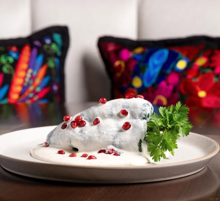 Chile relleno with pomegranate crema